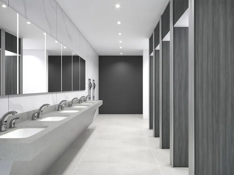 Commercial bathroom with tiled walls and a row of basins, Canberra