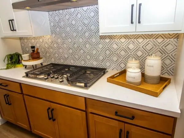 Custom-printed splashback with a full-width image behind a cooktop, Canberra kitchen