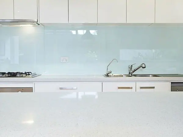 Glass splashback panel behind a kitchen cooktop, Canberra home