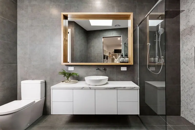 Large-format wall tiles laid in a wet area, Canberra home